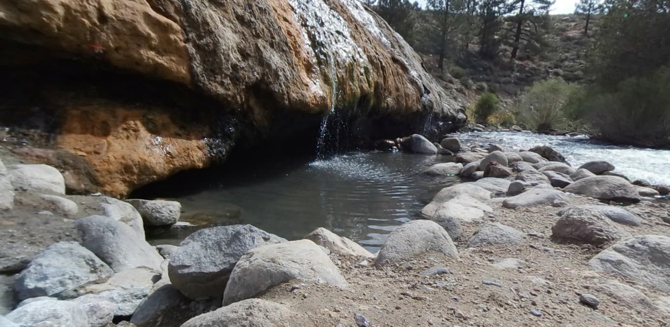 A short hike leads to hot waterfall-fed pools.